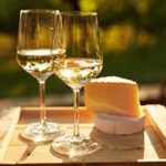 Two wine glasses with cheese