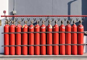 Row of large red fire extinguishers